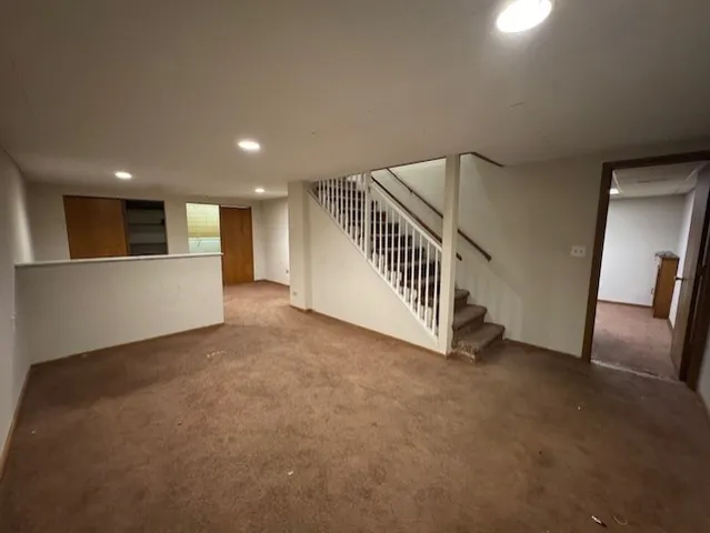 a view of a hallway with staircase