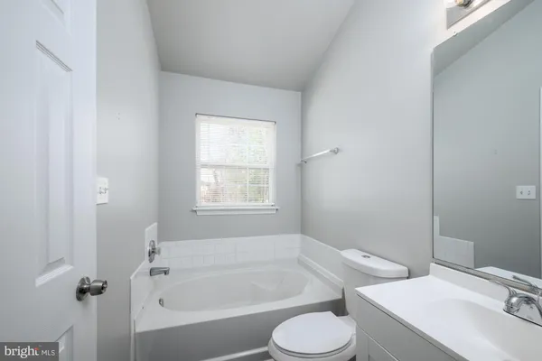 a bathroom with a sink toilet and bathtub