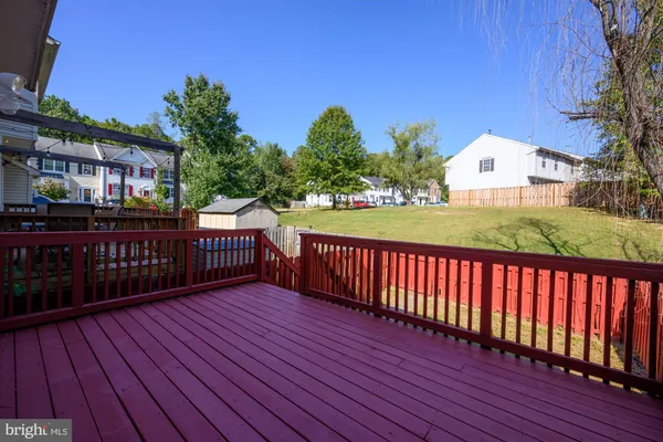 a view of a balcony with wooden floor