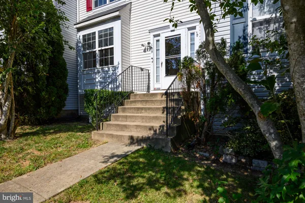 a small garden in the corner of a house