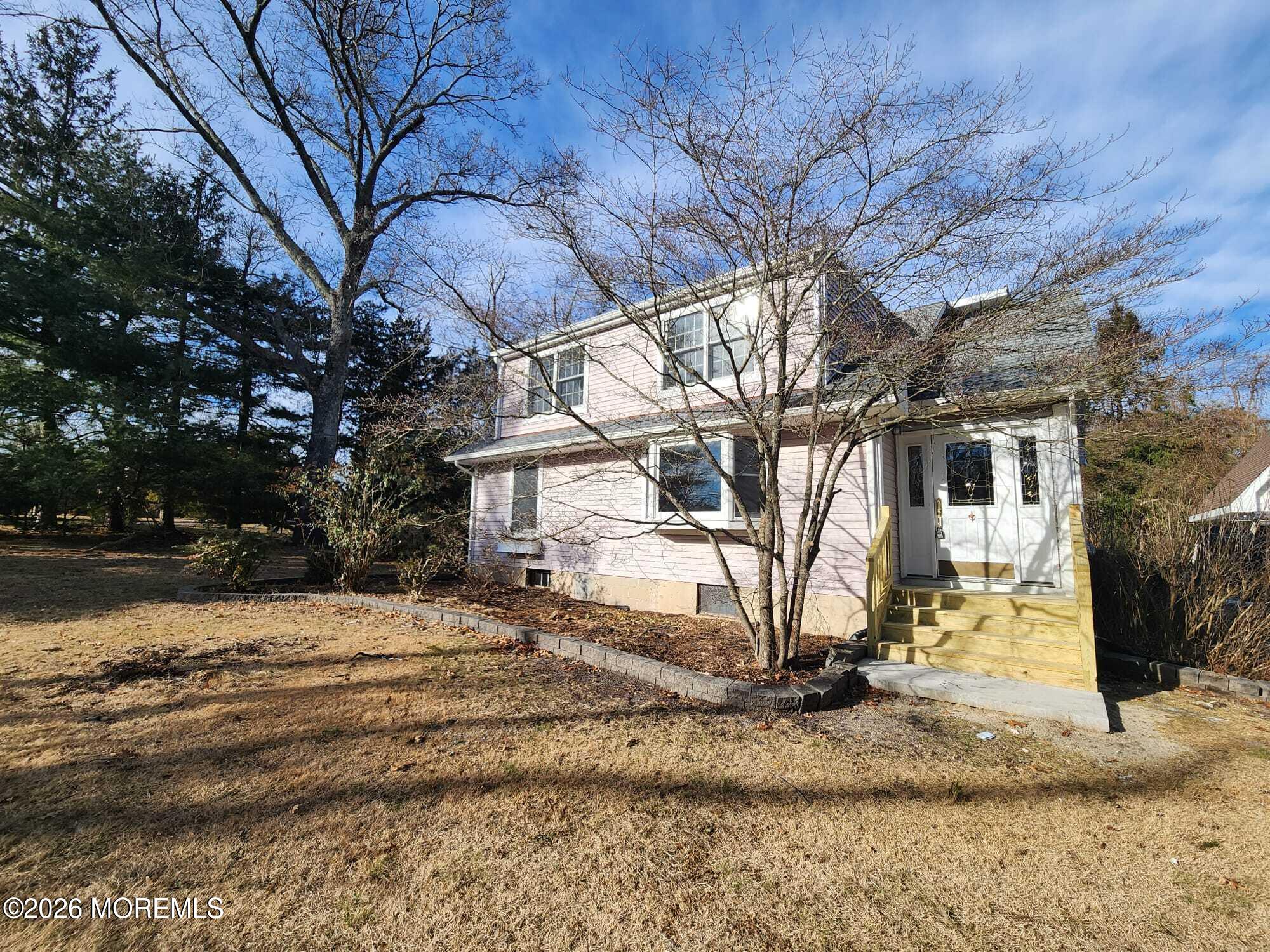 426 Bennetts Mills Road Jackson, NJ 08527 - Photo 1 of 20 a view of a house with a yard covered in snow