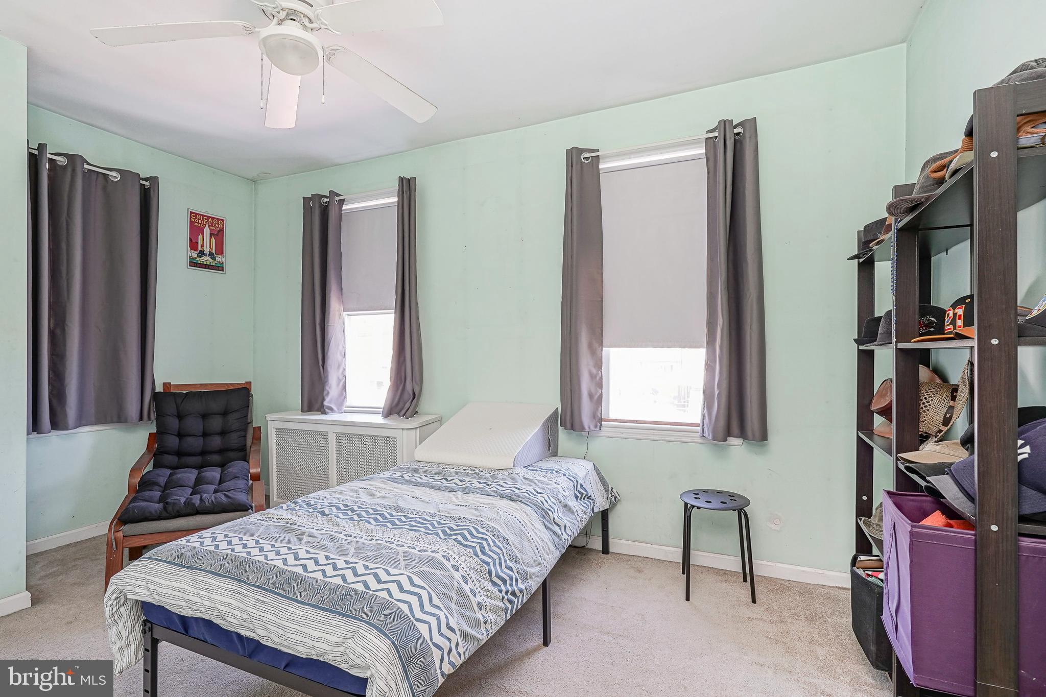 1919 Lansing Street Philadelphia, PA 19111 - Photo 14 of 22 a bedroom with a bed and a book shelf