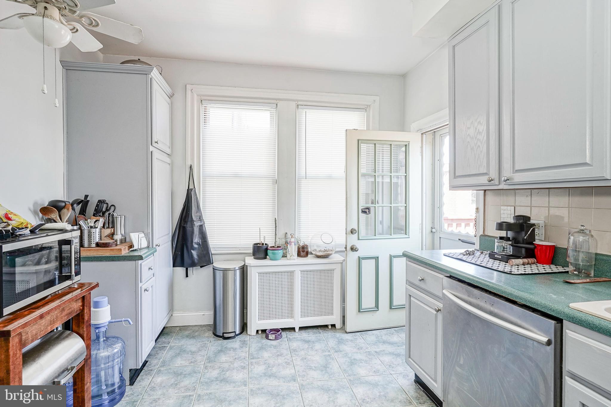 1919 Lansing Street Philadelphia, PA 19111 - Photo 8 of 22 a kitchen that has a sink and a stove