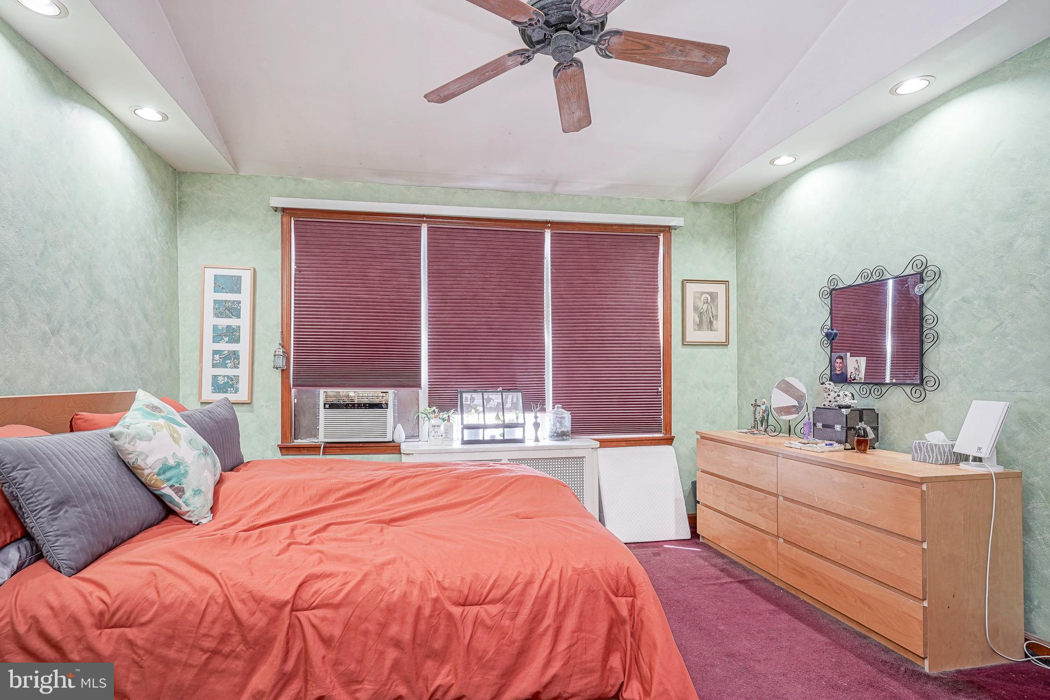 1919 Lansing Street Philadelphia, PA 19111 - Photo 10 of 22 a bedroom with a bed and a large mirror