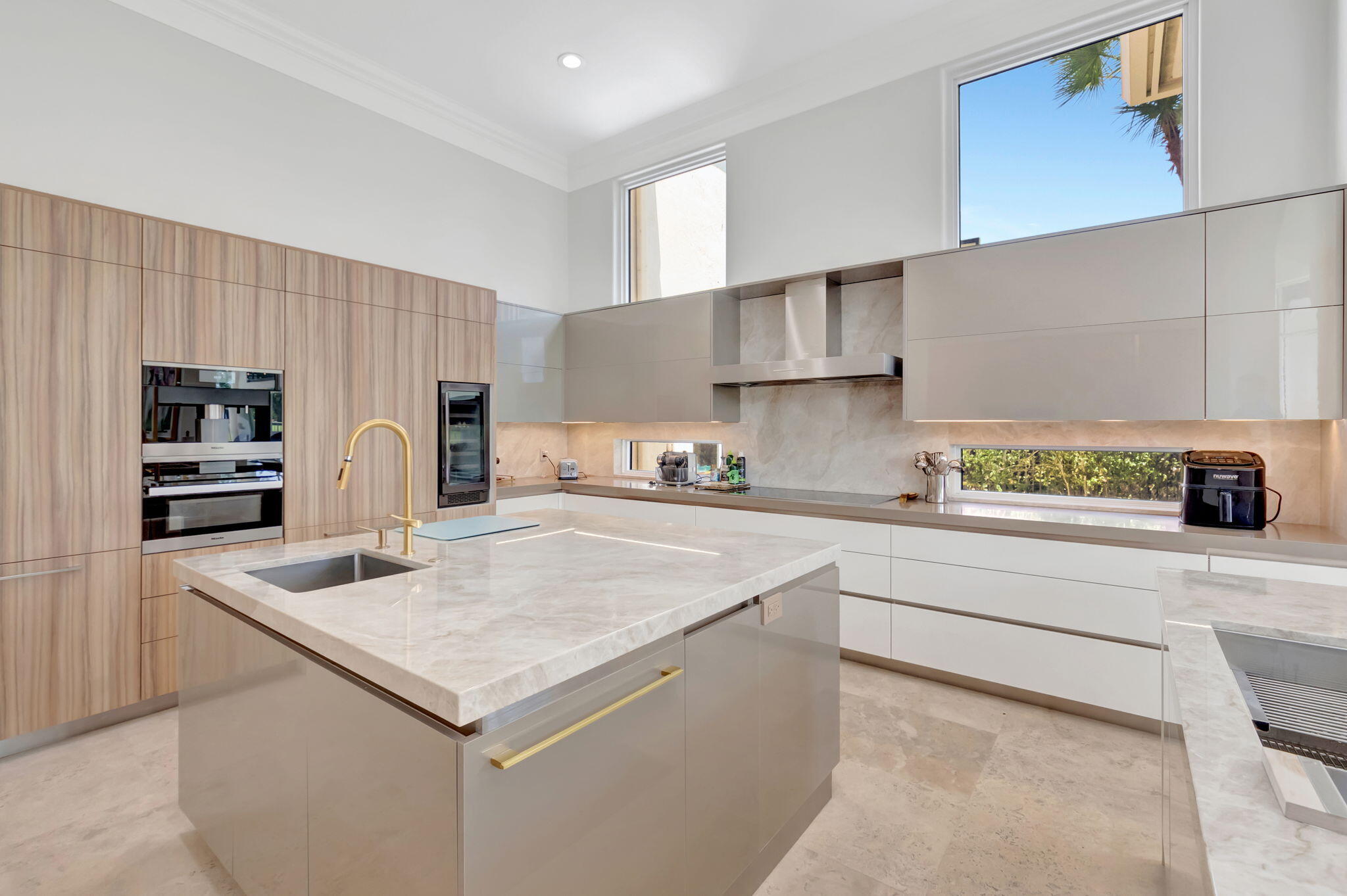 7090 Ayrshire Lane Boca Raton, FL 33496 - Photo 17 of 48 a kitchen with stainless steel appliances granite countertop a sink stove and refrigerator