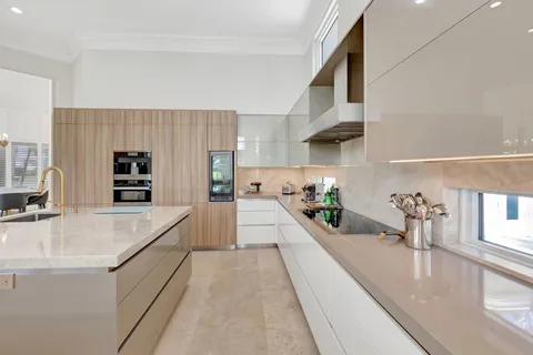 a kitchen with a sink stove and cabinets