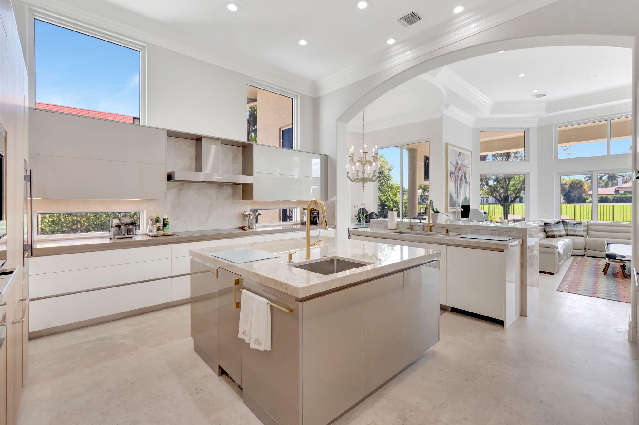 7090 Ayrshire Lane Boca Raton, FL 33496 - Photo 20 of 48 a kitchen with a sink stove and cabinets