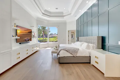 a spacious bathroom with a tub sink and mirror