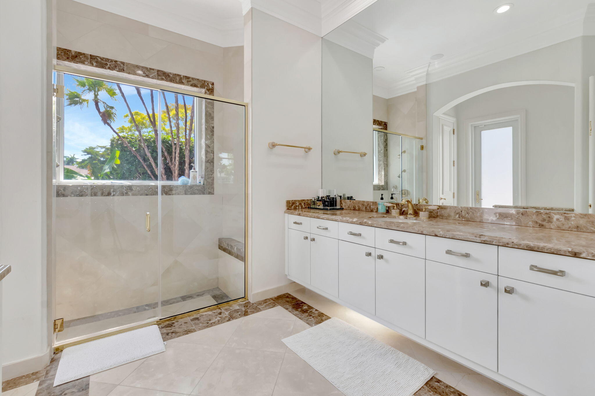 7090 Ayrshire Lane Boca Raton, FL 33496 - Photo 23 of 48 a spacious bathroom with a granite countertop sink and a mirror