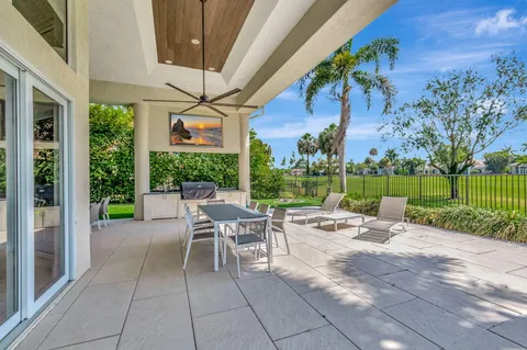 a view of an outdoor dining space with a patio