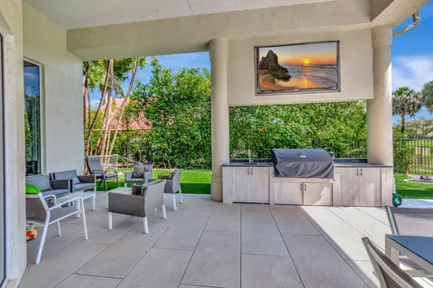 a view of a patio with a table and chairs