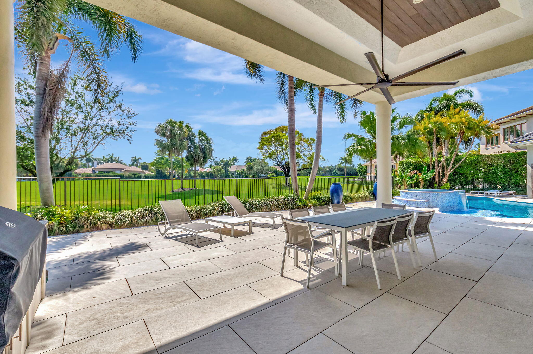 7090 Ayrshire Lane Boca Raton, FL 33496 - Photo 37 of 48 a view of a patio with a table and chairs