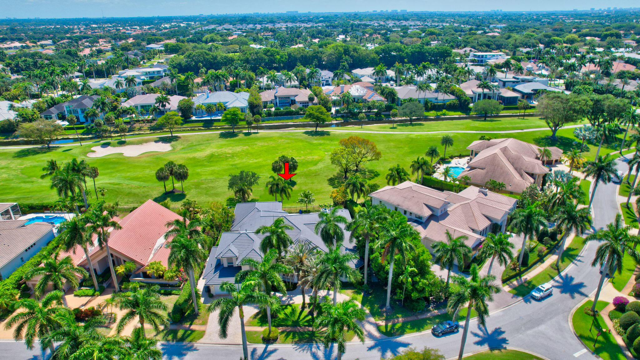 7090 Ayrshire Lane Boca Raton, FL 33496 - Photo 40 of 48 an aerial view of a houses with a yard and lake view