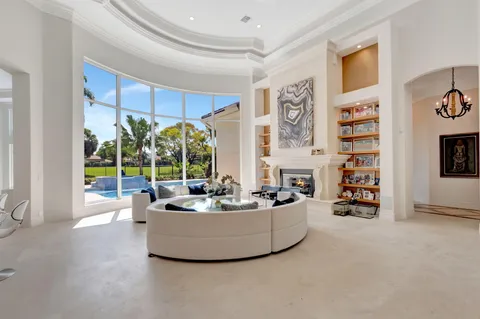a living room with fireplace furniture and decor