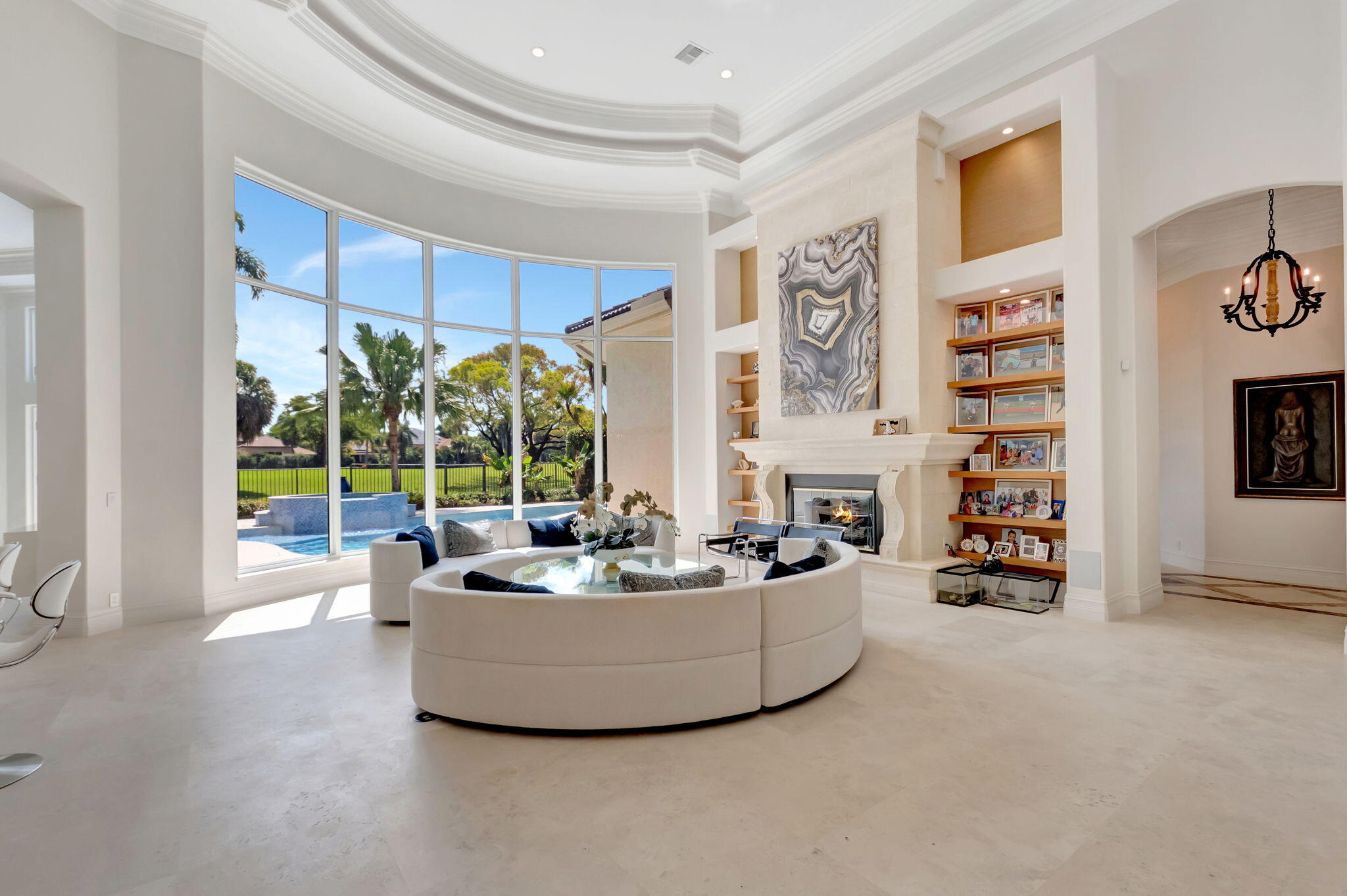 7090 Ayrshire Lane Boca Raton, FL 33496 - Photo 7 of 48 a living room with fireplace furniture and a large window