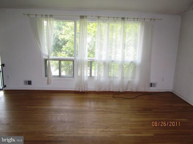 6923 Vancouver Road Springfield, VA 22152 - Photo 3 of 13 a view of wooden floor and cabinet in a room