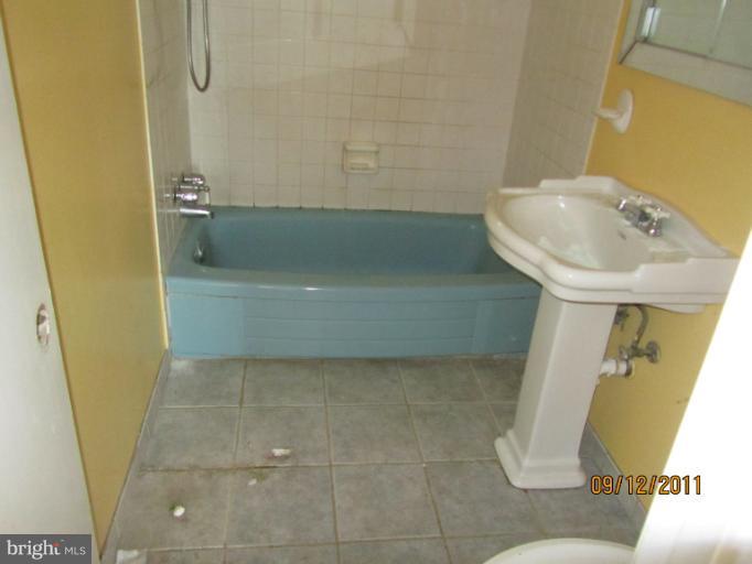 6923 Vancouver Road Springfield, VA 22152 - Photo 4 of 13 a bathroom with a sink and a mirror
