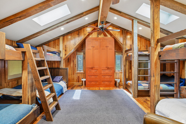 10205 East Moose Loop Road Salt Lake City, UT 84121 - Photo 23 of 50 Vaulted ceiling room featuring exposed wood beams and skylights