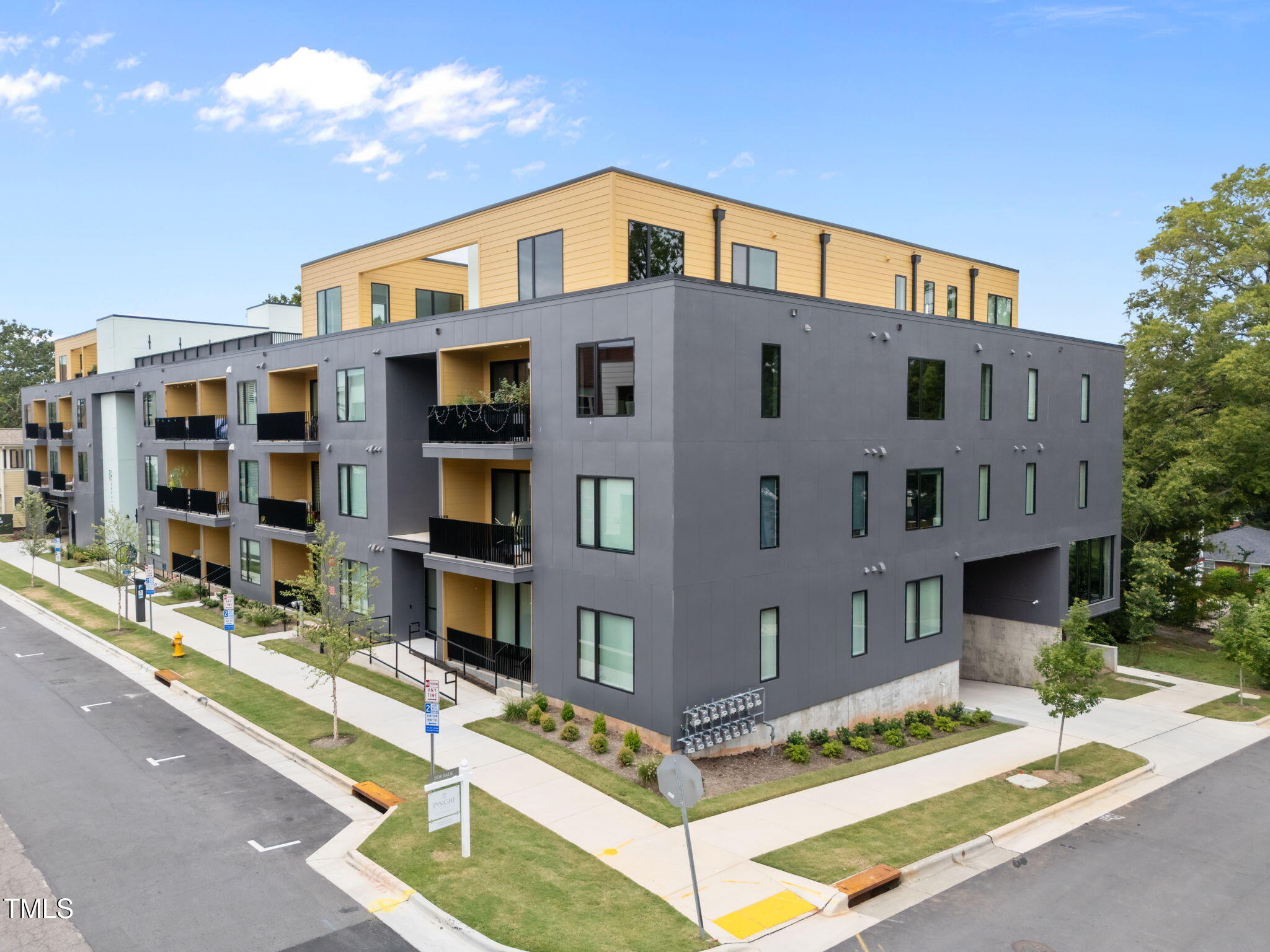 29 Enterprise Street, Unit 309 Raleigh, NC 27607 - Photo 25 of 34 a front view of residential houses with street