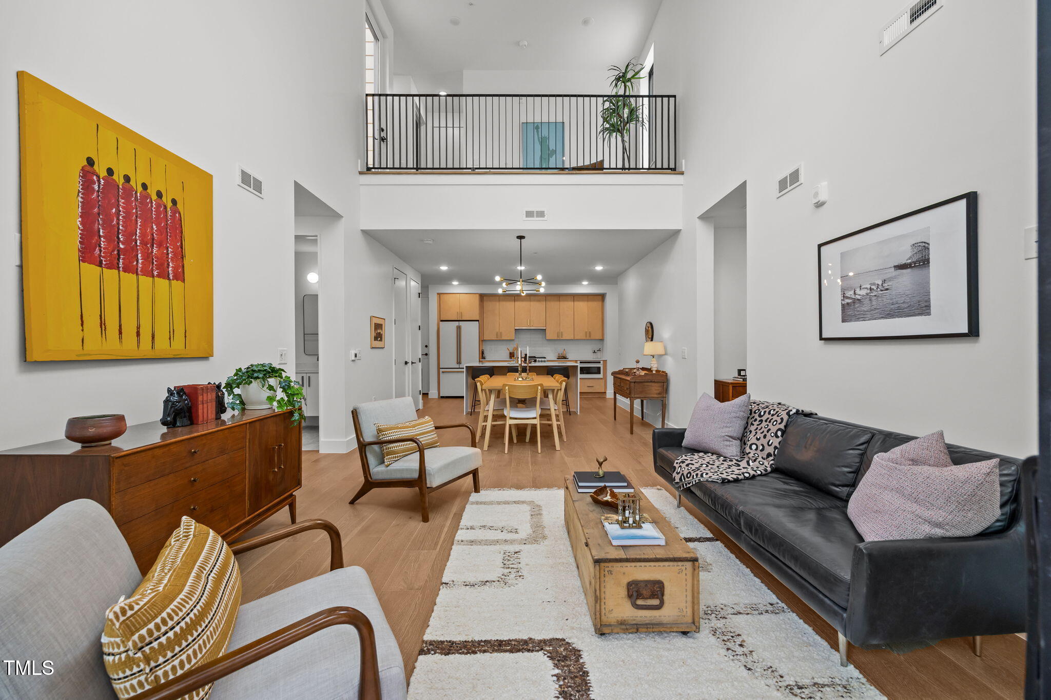 29 Enterprise Street, Unit 309 Raleigh, NC 27607 - Photo 2 of 34 a living room with furniture and wooden floor