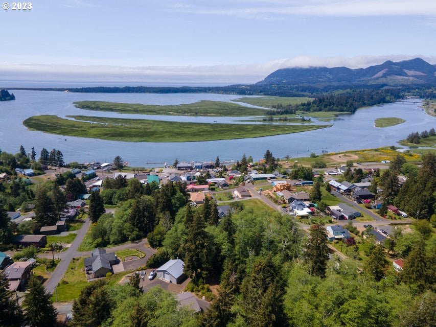 Rector Street Wheeler, OR 97147 - Photo 3 of 13 a view of a city with mountains in the background