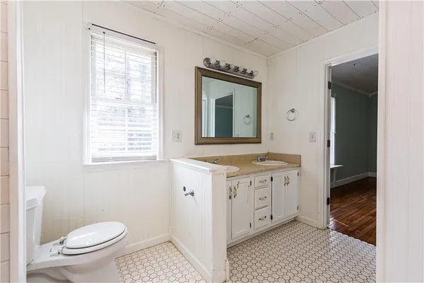 an empty room with a ceiling fan and a window
