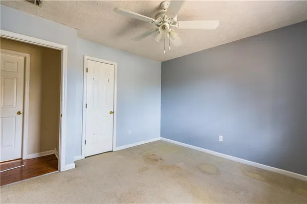 a room that has a bed and a wooden floor