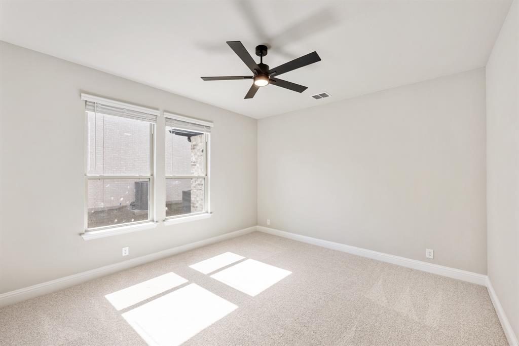 2016 Dundalk Lane Forney, TX 75126 - Photo 18 of 40 an empty room with windows and fan