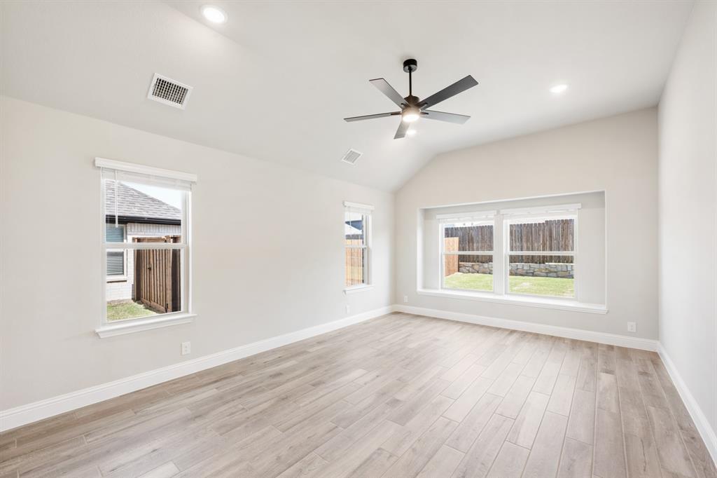 2016 Dundalk Lane Forney, TX 75126 - Photo 20 of 40 a view of an empty room with a window and wooden floor