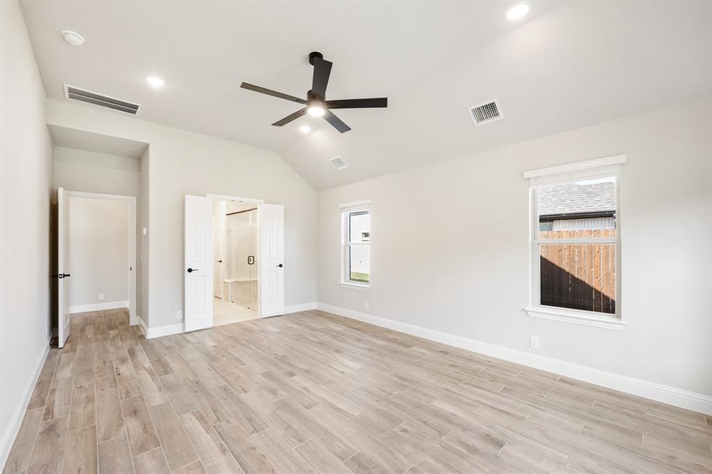 2016 Dundalk Lane Forney, TX 75126 - Photo 22 of 40 a view of empty room with wooden floor and fan