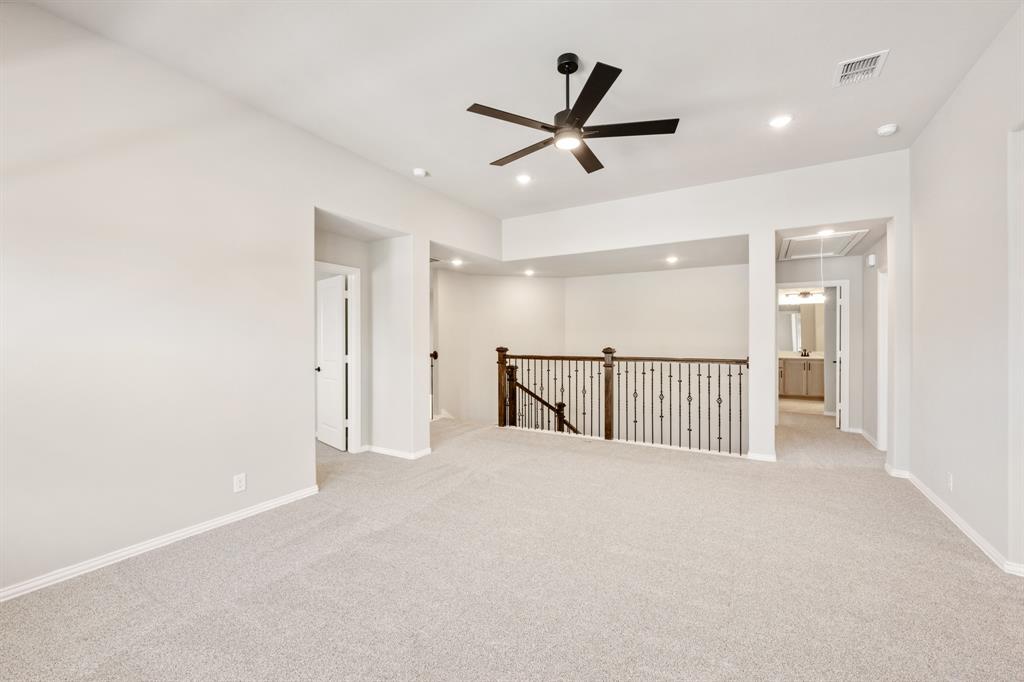 2016 Dundalk Lane Forney, TX 75126 - Photo 28 of 40 a view of a hallway with a ceiling fan