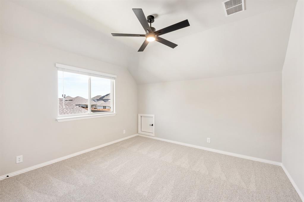 2016 Dundalk Lane Forney, TX 75126 - Photo 29 of 40 an empty room with ceiling fan and windows