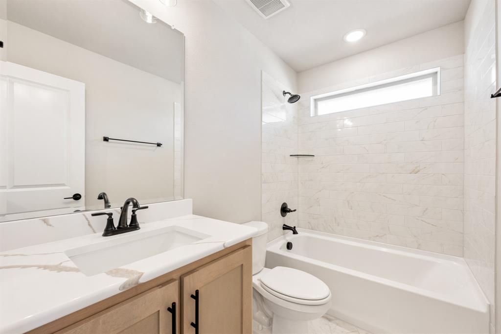 2016 Dundalk Lane Forney, TX 75126 - Photo 31 of 40 a bathroom with a sink a toilet and a bathtub