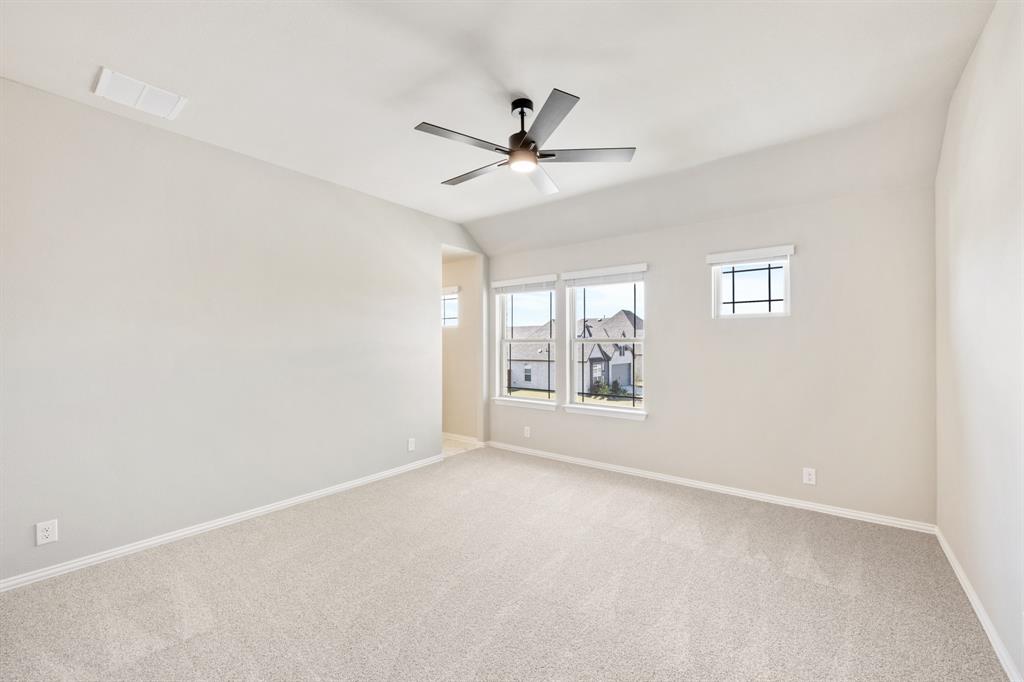 2016 Dundalk Lane Forney, TX 75126 - Photo 32 of 40 an empty room with windows and fan