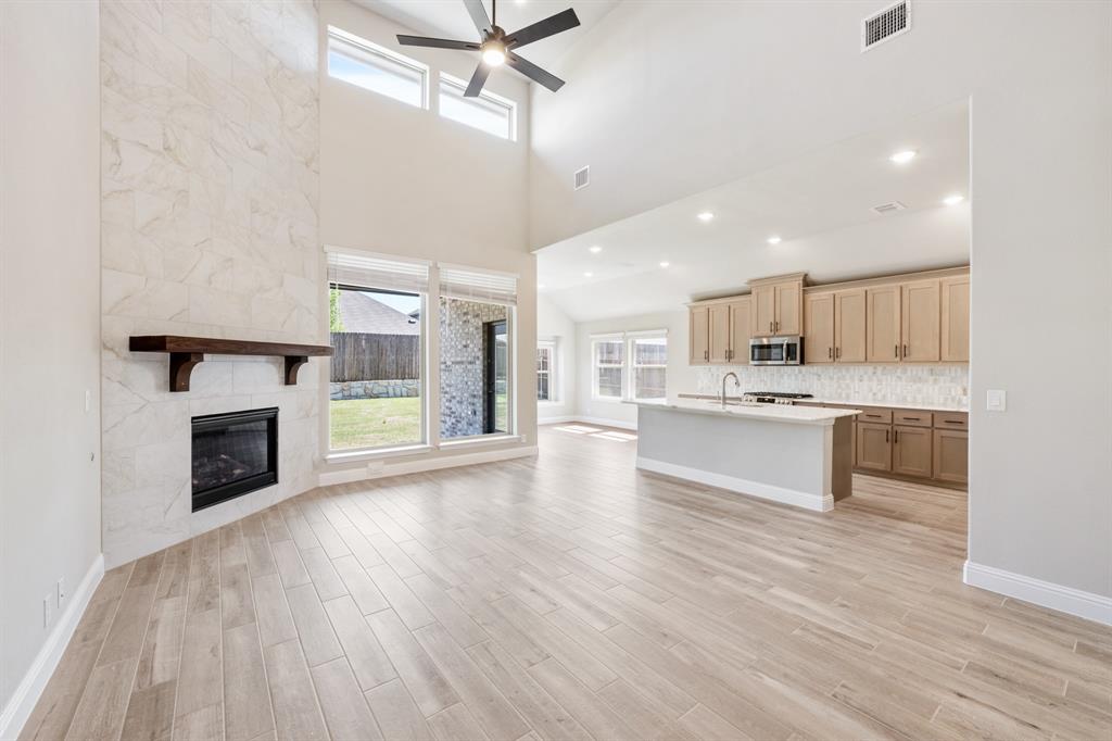 2016 Dundalk Lane Forney, TX 75126 - Photo 10 of 40 a large kitchen with cabinets wooden floor and a sink