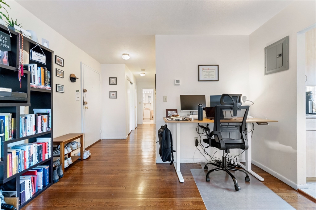 425 South Huntington Avenue, Unit 6 Boston, MA 02130 - Photo 7 of 19 a view of a workspace with furniture and a bookshelf