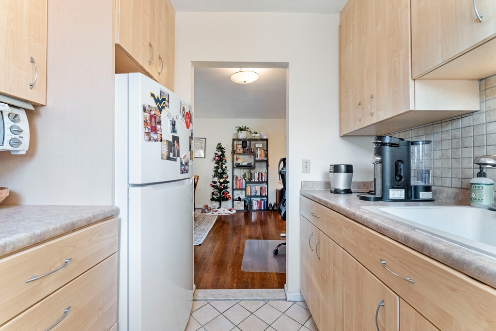 425 South Huntington Avenue, Unit 6 Boston, MA 02130 - Photo 9 of 19 a view of a kitchen with fridge and workspace