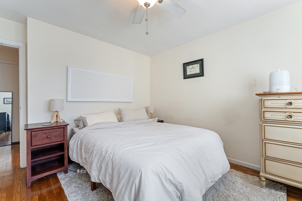 425 South Huntington Avenue, Unit 6 Boston, MA 02130 - Photo 10 of 19 a bedroom with a bed and a ceiling fan