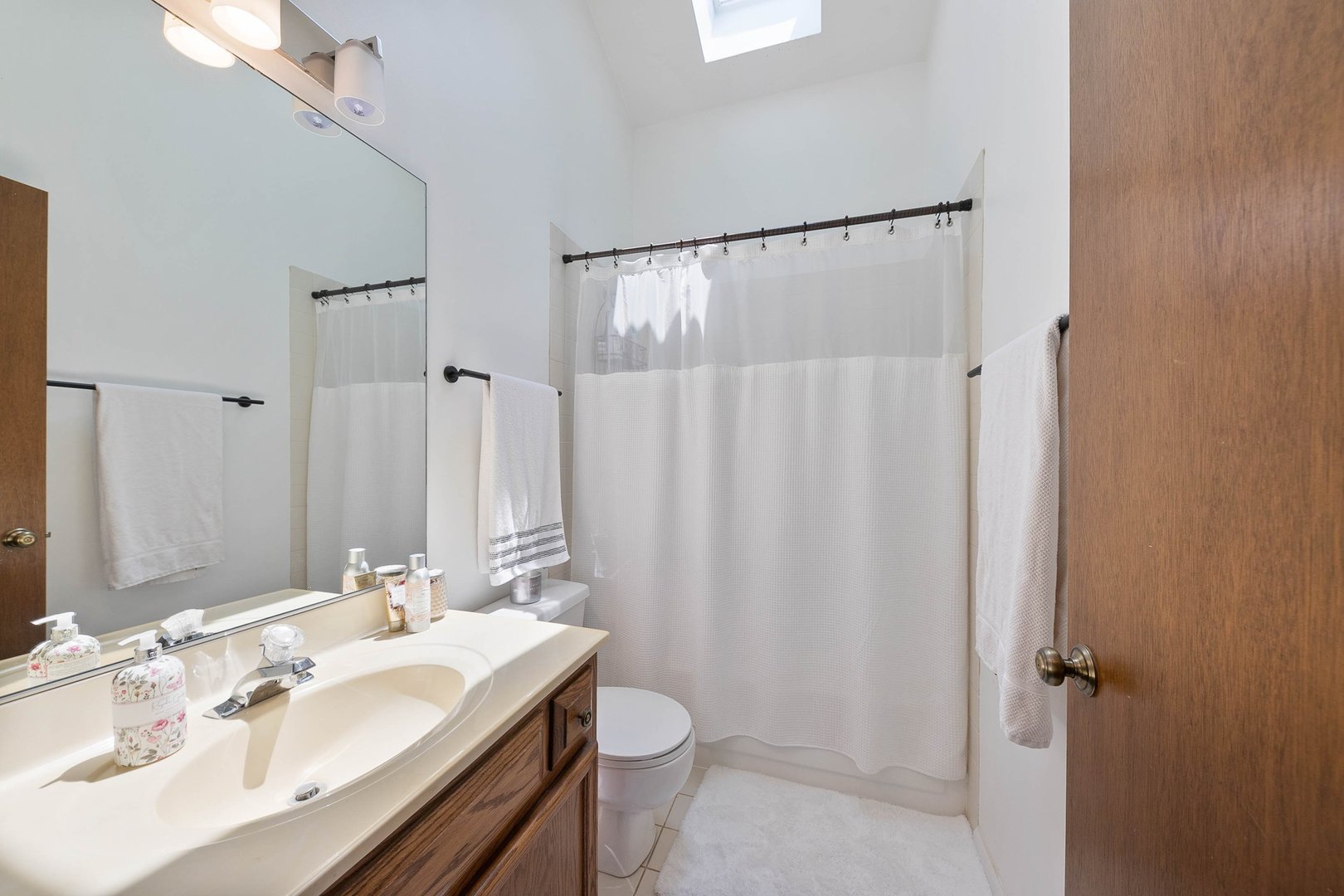 16 Redstart Road Naperville, IL 60565 - Photo 19 of 23 a bathroom with a sink toilet and shower