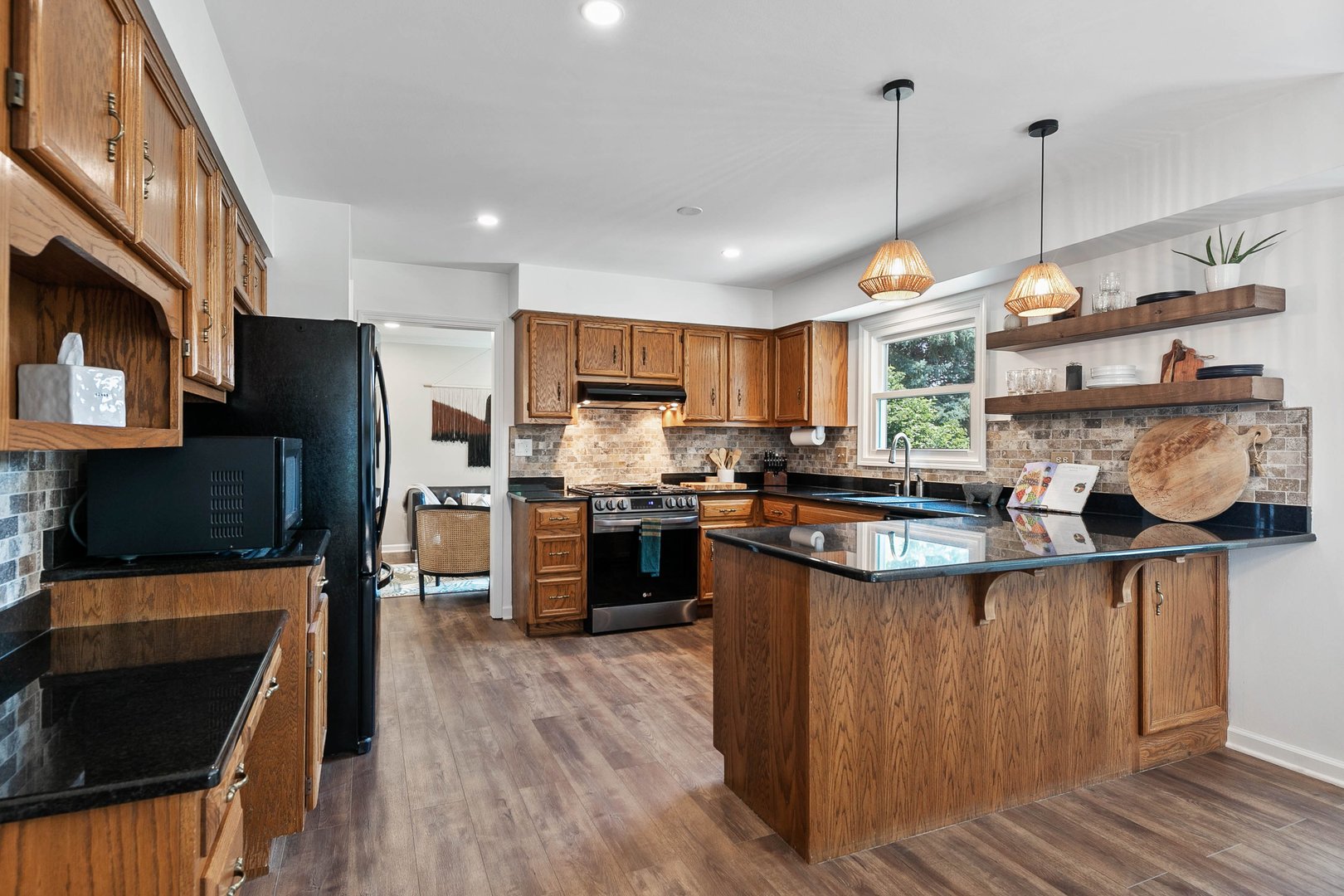 16 Redstart Road Naperville, IL 60565 - Photo 8 of 23 a kitchen with stainless steel appliances granite countertop a refrigerator a stove top oven a sink dishwasher and a refrigerator with wooden floor