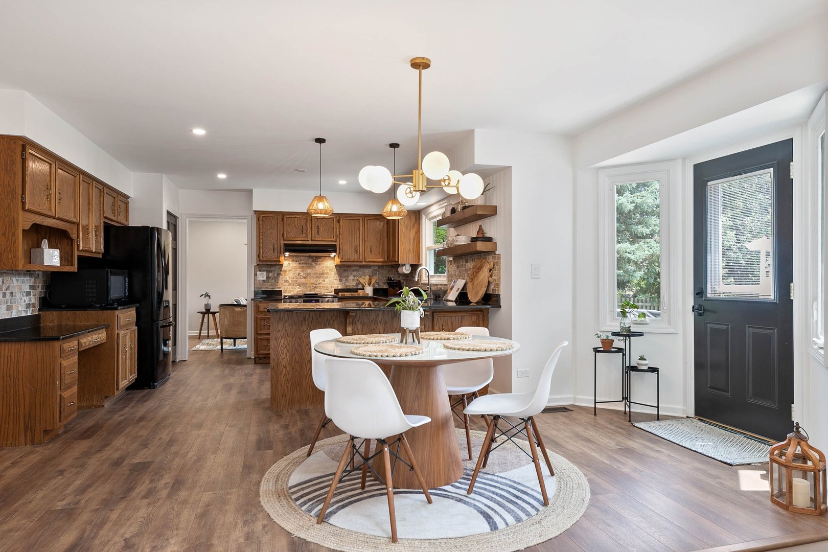 16 Redstart Road Naperville, IL 60565 - Photo 10 of 23 a view of a dining room with furniture a kitchen and chandelier