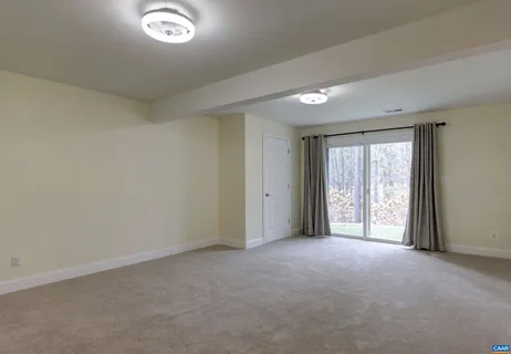 a front view of a house with a garden and plants