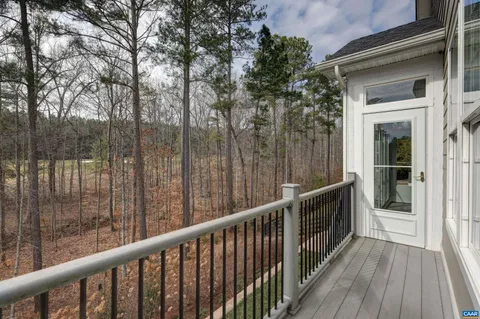 a aerial view of a house with a yard and potted plants