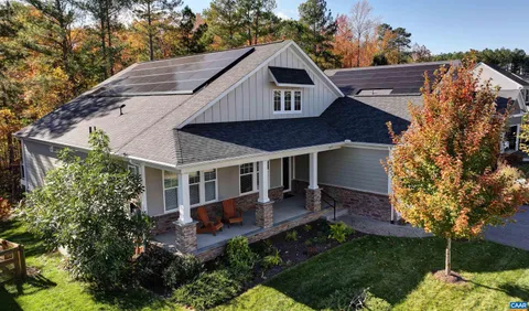a view of a backyard with sitting area