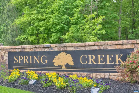 a tennis court with trees in the background
