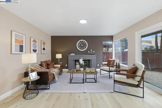 a living room with furniture and a clock