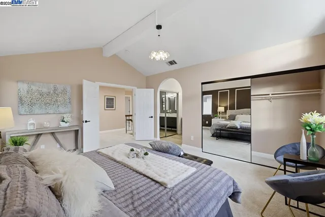 a bedroom with a bed and furniture