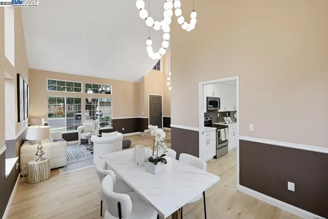 a view of a dining room with furniture window and wooden floor