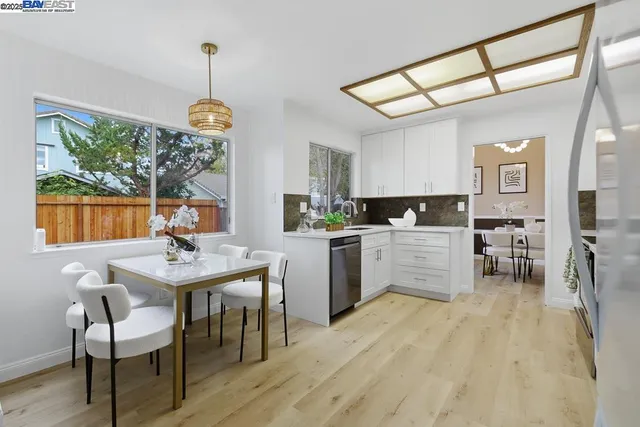 a kitchen with furniture and window