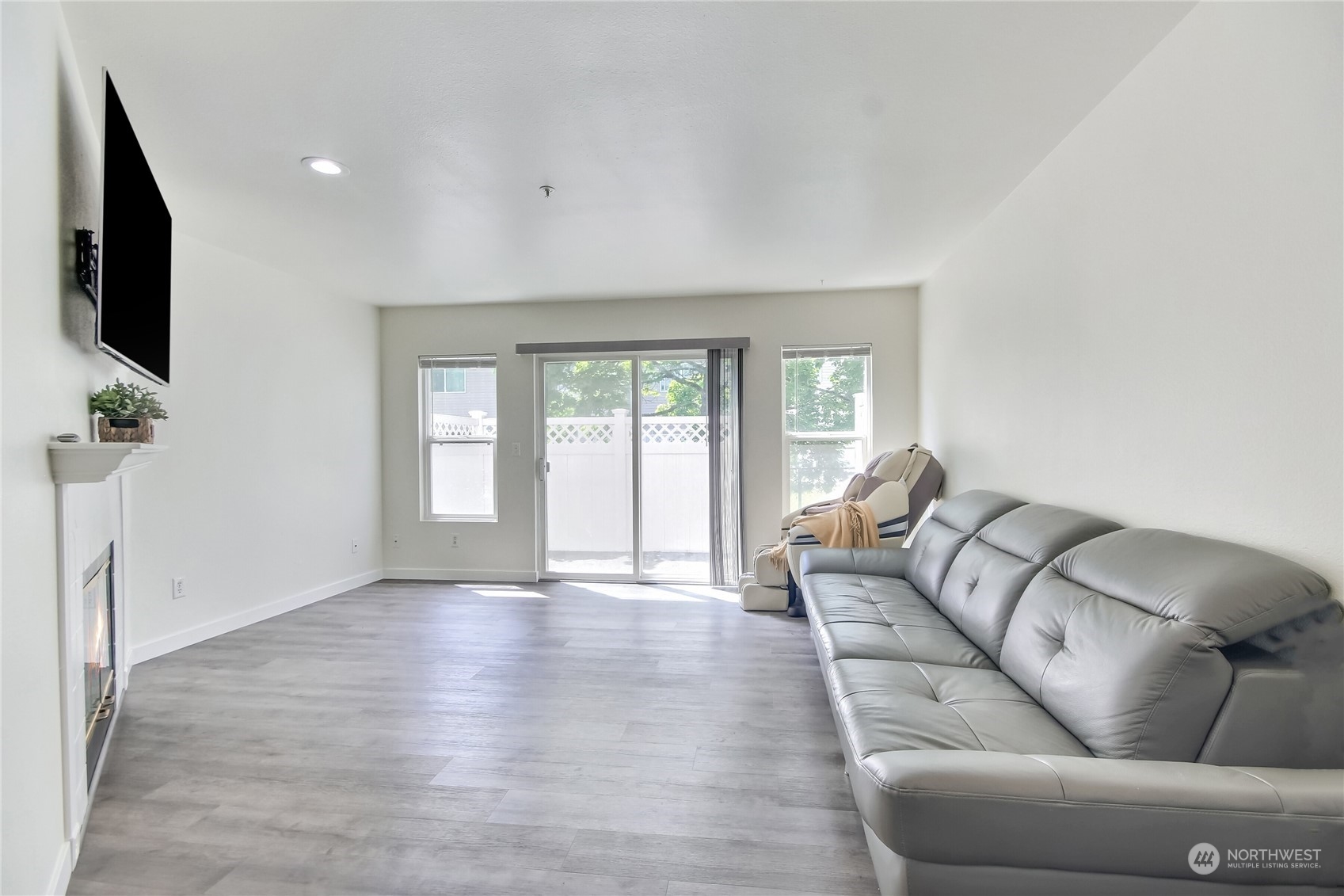 1825 South 330th Street, Unit E3 Federal Way, WA 98003 - Photo 11 of 26 a living room with furniture and a flat screen tv
